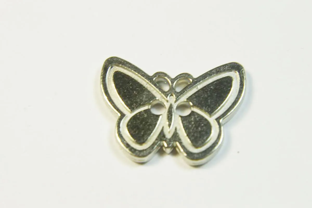 Пуговица  "БАБОЧКА" металлическая, два прокола,  цвет серебряный,  диаметр 22 ммизображение