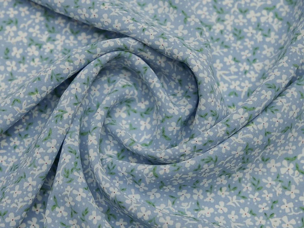 Принтованная плательная ткань, с рисунком "Мелкие разноцветные цветочки на голубом"изображение