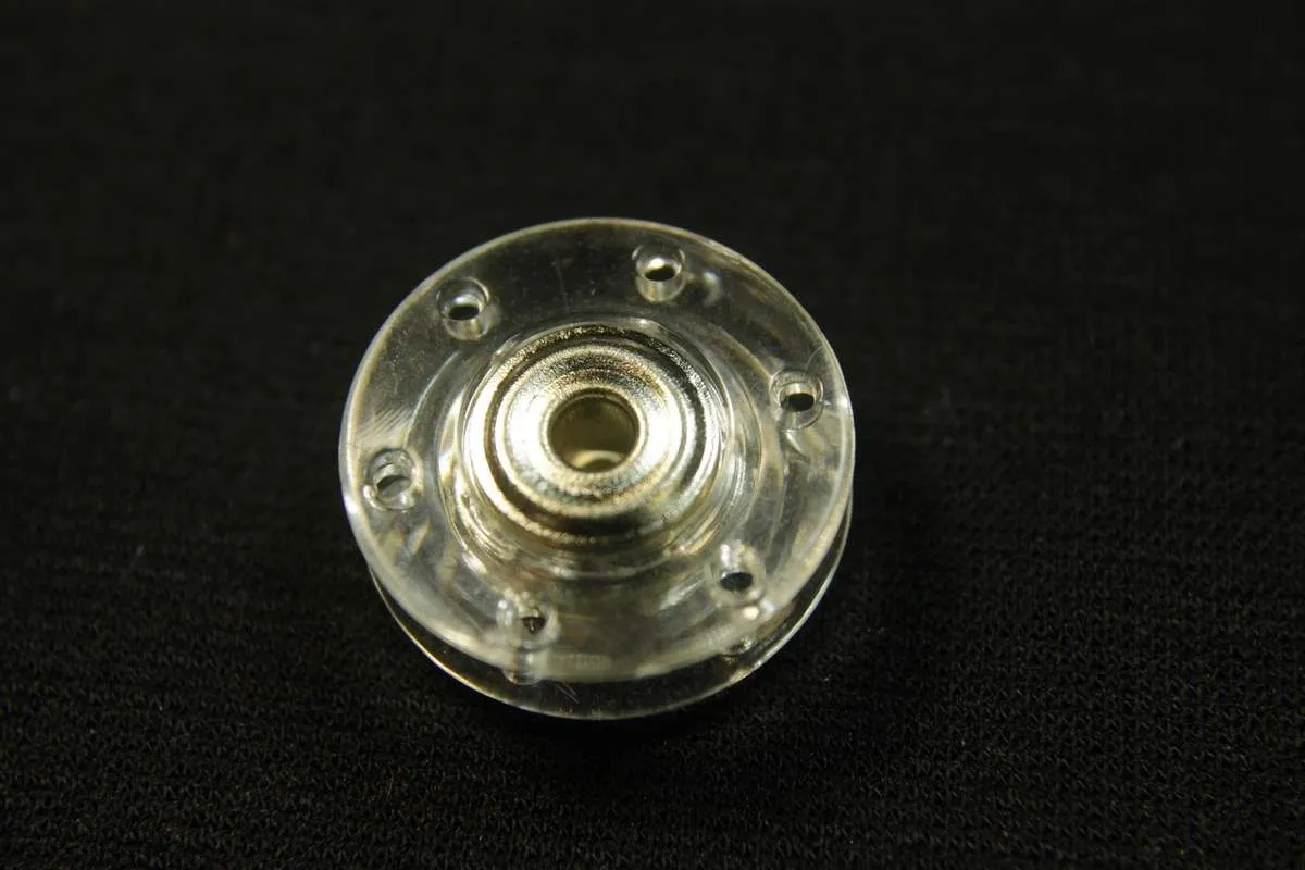 Кнопка пришивная круглая, прозрачный пластик с металлом (никель), диаметр 21 ммизображение