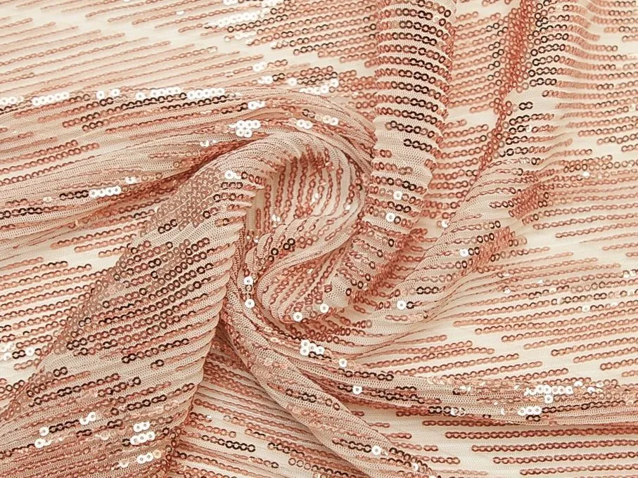 Ткань плательная с диагональным рисунком из  пайеток медного цвета на молочной сеткеизображение