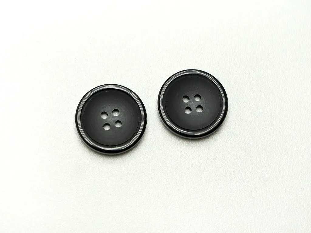 Пуговица пластмассовая, 4 прокола, черно-серого цвета,матовая, диаметр 25 ммизображение