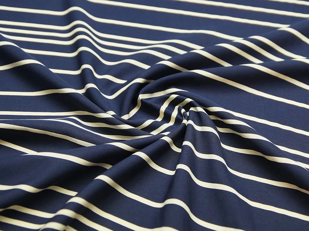Плательная ткань в горизонтальную полоску на темно-синем фонеизображение