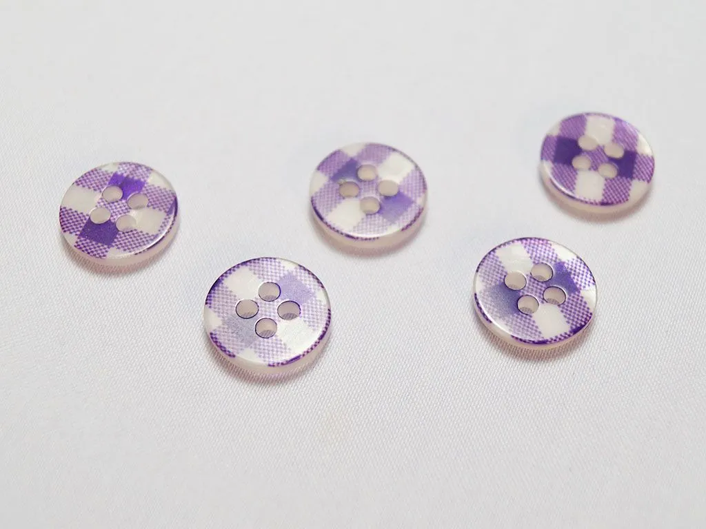 Пуговица пластмассовая, четыре прокола, фиолетовая клетка, диаметр 11 ммизображение