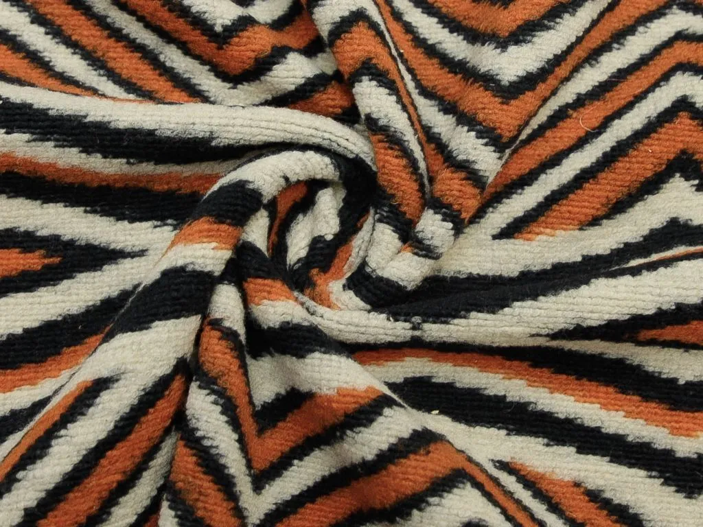 Буклированная пальтовая ткань с абстрактным орнаментом в черно-оранжевом тонеизображение